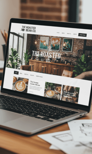 Website Design for Coffee Businesses Website design for coffee businesses displayed on a laptop screen, showing a modern café website layout with coffee imagery, blog sections, and clean navigation.
