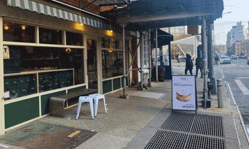 Outdoor view and sidewalk seating at Noa a Café West Village in the West Village, Manhattan.