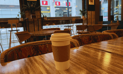 Natura Café Chelsea – Coffee at Dream Downtown Hotel 4 Americano in takeaway cup inside Natura Café Chelsea with window view of Chelsea Manhattan NYC