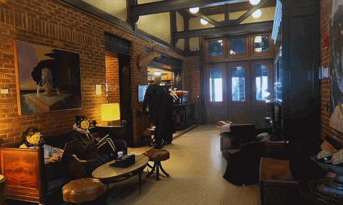 Intelligentsia Coffee Chelsea – Best Coffee NYC | FlorR 2 Interior of Intelligentsia Coffee Chelsea with exposed brick walls and people working on laptops in Manhattan NYC