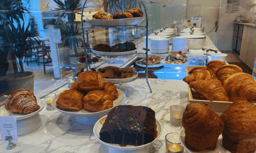 fresh croissants pastries and desserts display at Oases Coffee Shop Chelsea near Union Square New York City