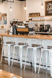 Andeworld 24 inch industrial metal bar stools with wooden seats set of four at coffee shop counter