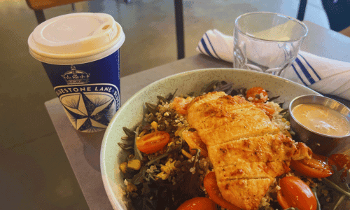 Bluestone Lane Chelsea Hudson Yards – Best Coffee NYC 4 grilled chicken salad with cherry tomatoes and coffee cup at Bluestone Lane Chelsea Hudson Yards NYC near the High Line