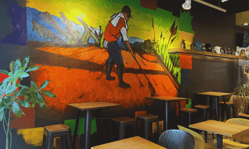 Colombian coffee farmer mural inside Cafe by the Girls Chelsea near the High Line New York City
