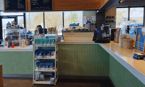 Bluestone Lane Chelsea Piers – Best Coffee NYC Waterfront 4 espresso bar and coffee bean display inside Bluestone Lane coffee shop Chelsea Piers NYC