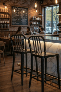 Flash Furniture Gael 24 inch black metal counter height stools with vertical slat back at coffee shop bar