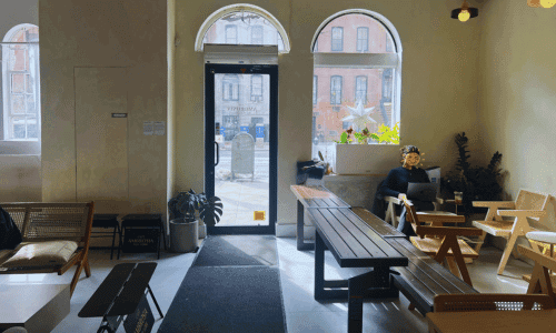 Cafe Ambrosia Chelsea – Best Coffee Near High Line NYC 2 interior seating area with street view windows at Cafe Ambrosia Chelsea on 23rd Street near the High Line NYC