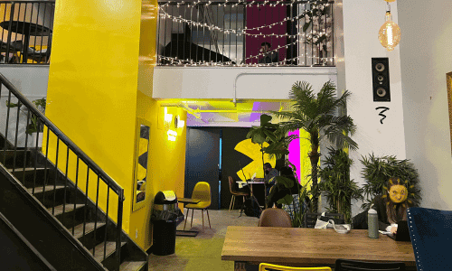 787 Coffee Chelsea – Best Puerto Rican Coffee NYC 2 interior with second floor seating at 787 Coffee Chelsea near Madison Square Garden and Macy’s NYC