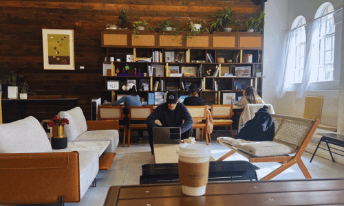 Cafe Ambrosia Chelsea – Best Coffee Near High Line NYC 1 interior of Cafe Ambrosia Chelsea on 23rd Street near the High Line New York City with seating and work area