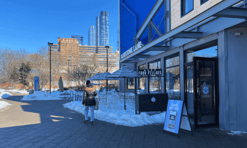 Bluestone Lane Chelsea Piers – Best Coffee NYC Waterfront 1 Bluestone Lane coffee shop exterior at Chelsea Piers NYC on a snowy winter day