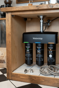 Waterdrop TSA under sink water filtration system installed in coffee shop cabinet