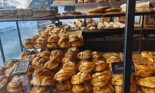Fabrique West Village – Best Swedish Bakery and Coffee NYC 1 Bakery display of cinnamon buns and assorted pastries at Fabrique West Village coffee shop in NYC
