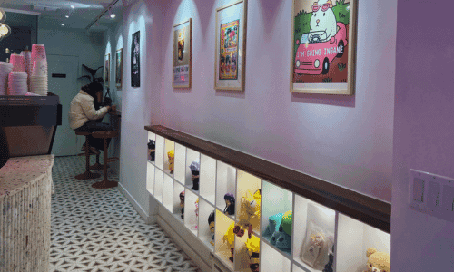 Kawaii Coffee West Village – Best Vietnamese Coffee NYC 1 Interior of Kawaii Coffee West Village Vietnamese coffee shop in NYC with seating and colorful wall art